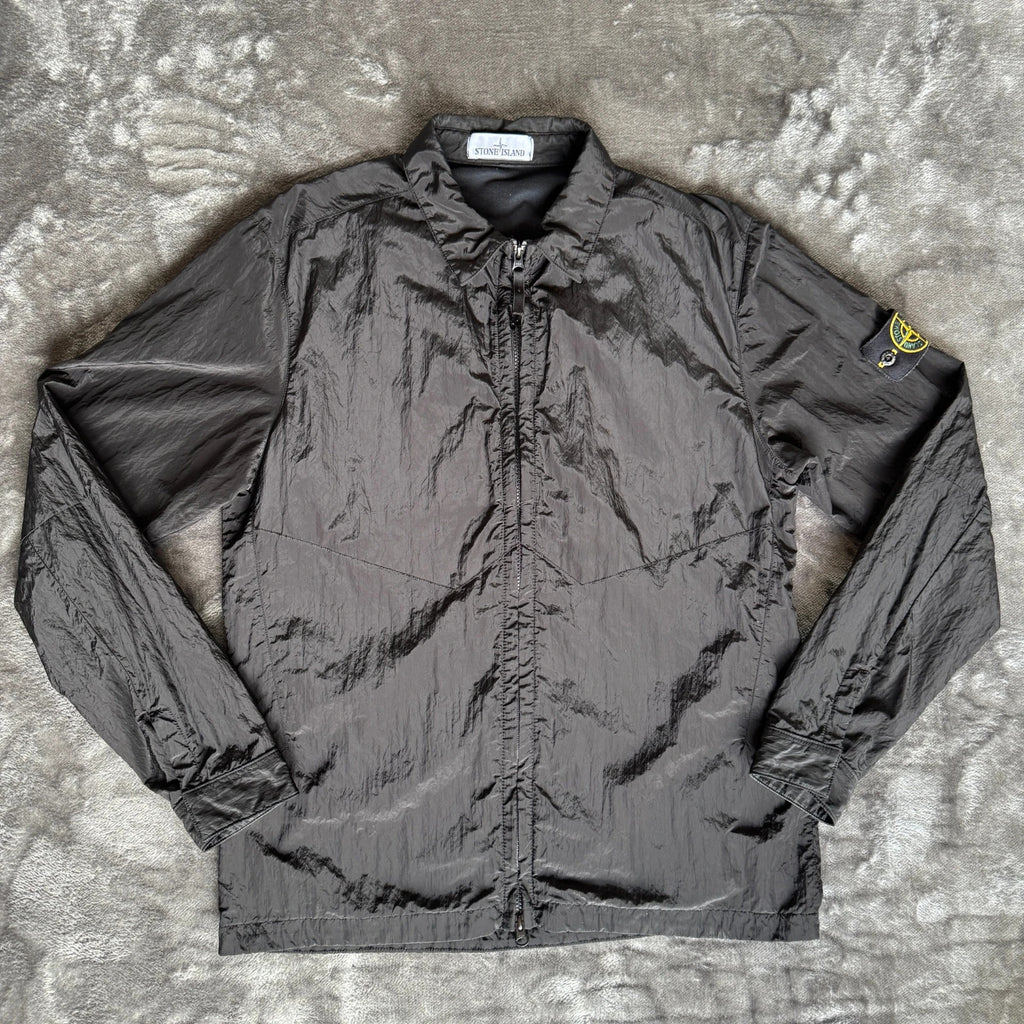 Stone Island black overshirt with logo badge and nylon metal material.