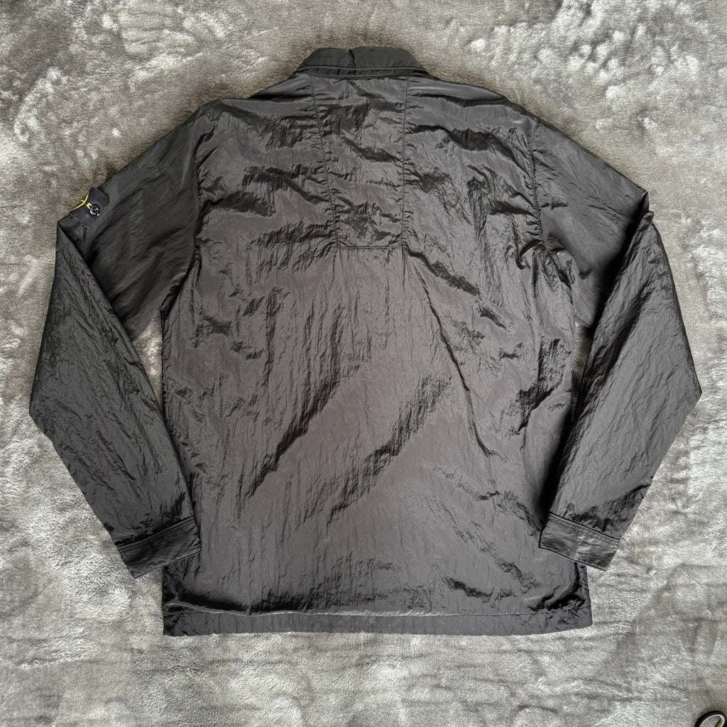 Stone Island black overshirt with logo badge and nylon metal material.