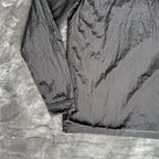 Stone Island black overshirt with logo badge and nylon metal material.