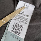 Stone Island black overshirt with logo badge and nylon metal material.