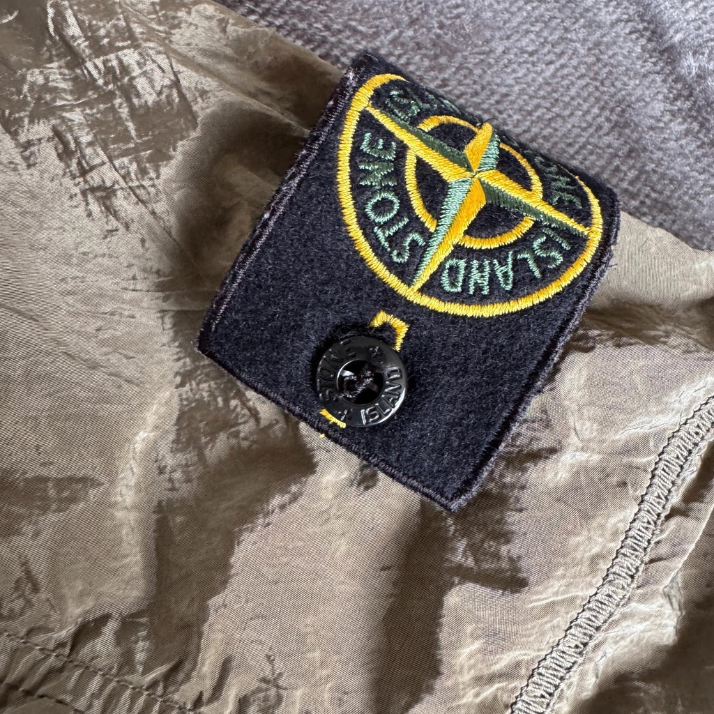 Stone Island khaki overshirt with logo patch and nylon metal cotton blend material.