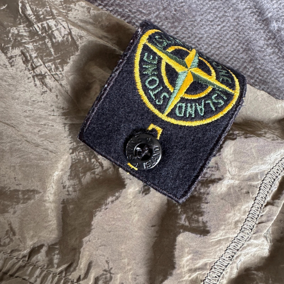 Stone Island khaki overshirt with logo patch and nylon metal cotton blend material.