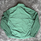 C.P. Company green overshirt with Chrome-R pocket and lens detail, brand new condition.