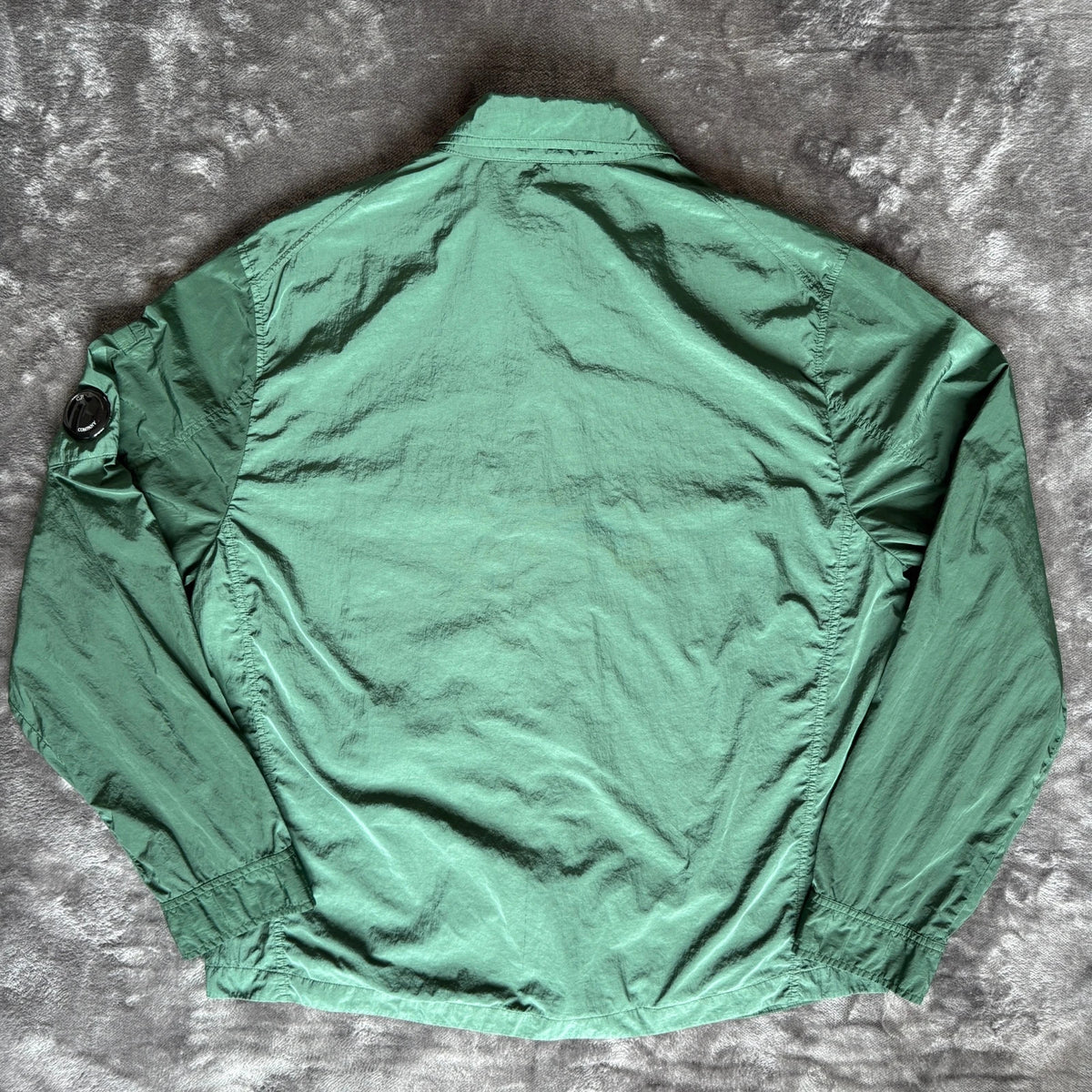 C.P. Company green overshirt with Chrome-R pocket and lens detail, brand new condition.