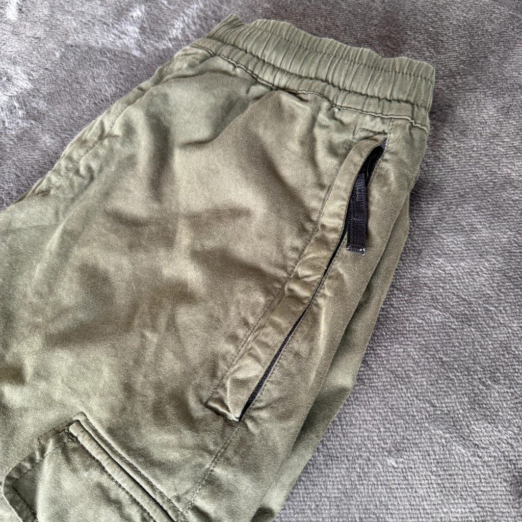 Stone Island khaki cuffed cargo trousers with logo patch and multiple pockets.