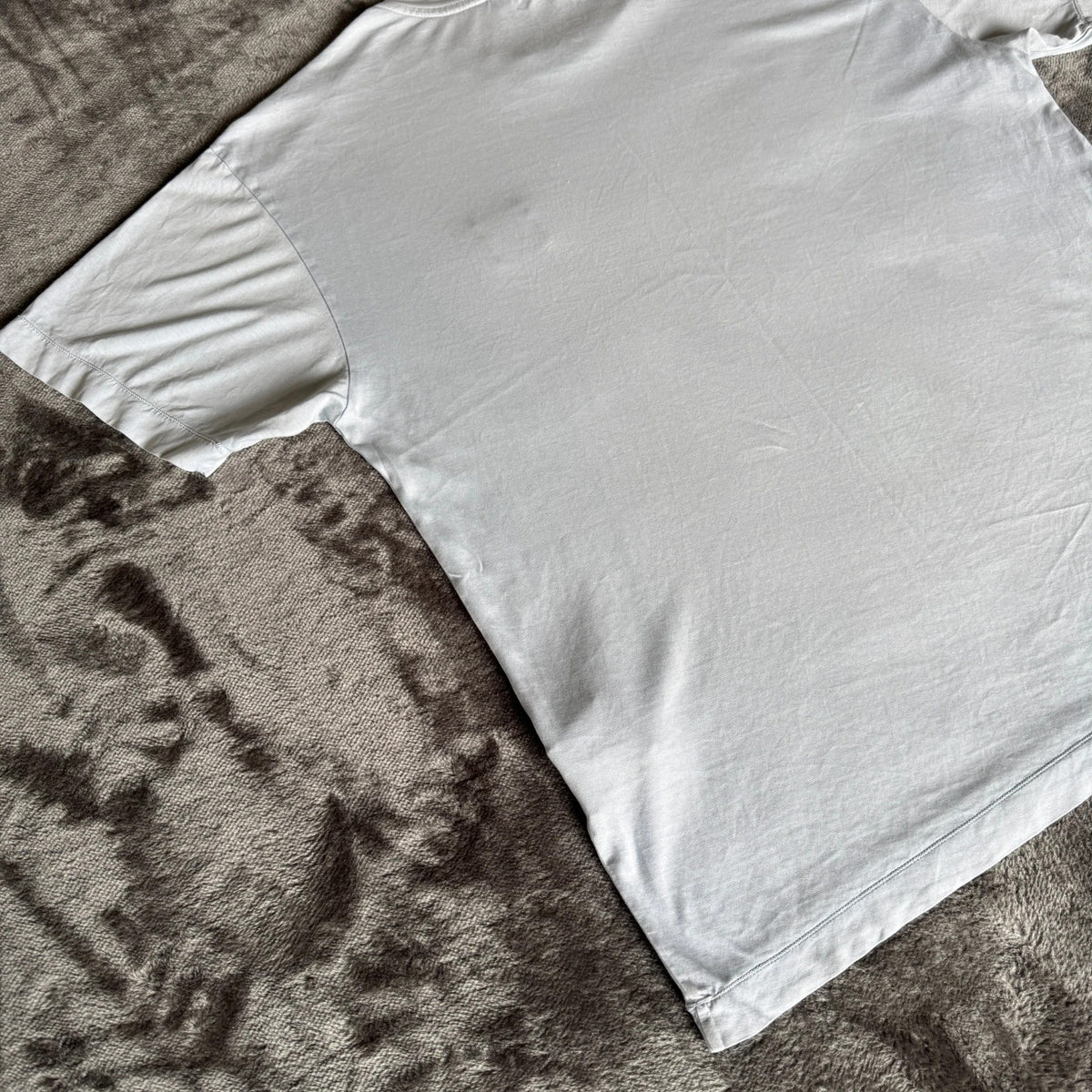 Stone Island light blue t-shirt with logo patch and crew neck design.