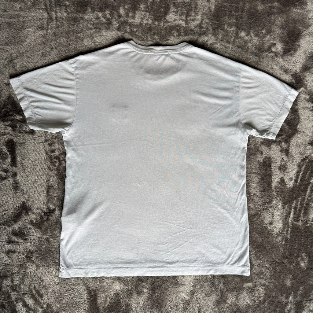 Stone Island light blue t-shirt with logo patch and crew neck design.