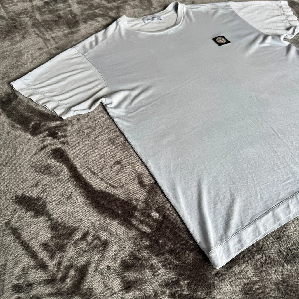 Stone Island light blue t-shirt with logo patch and crew neck design.