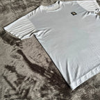Stone Island light blue t-shirt with logo patch and crew neck design.