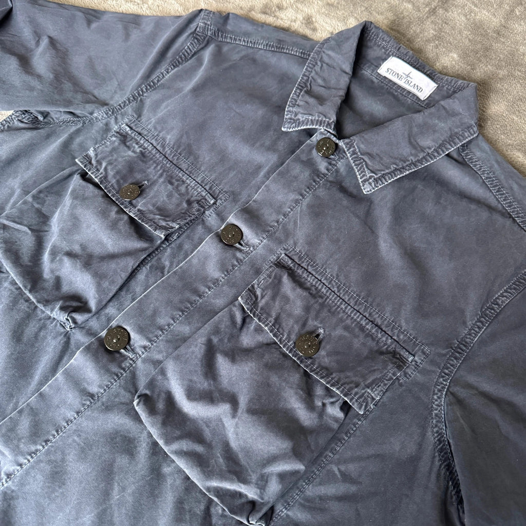 Stone Island navy overshirt with multi pockets and iconic compass logo.