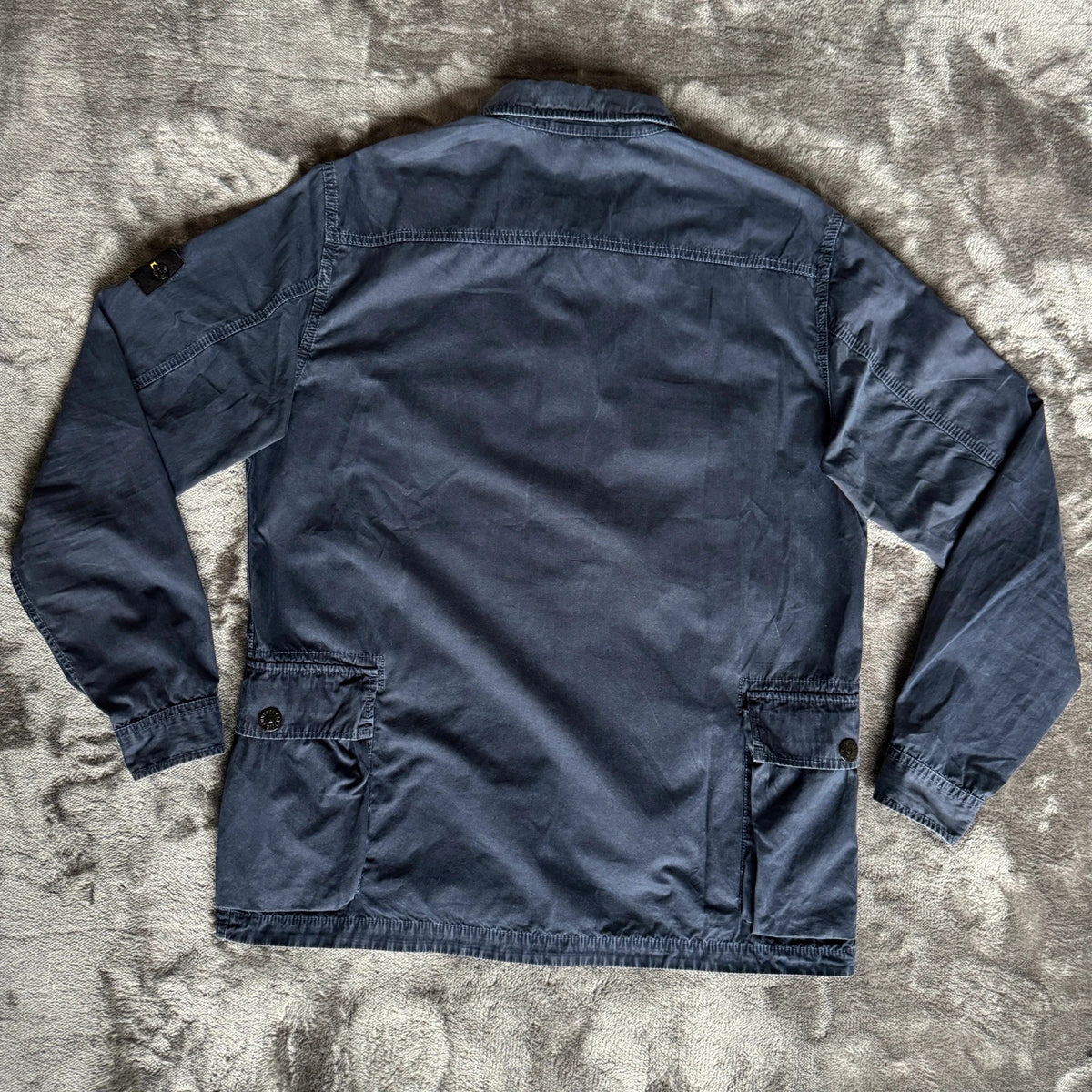 Stone Island navy overshirt with multi pockets and iconic compass logo.