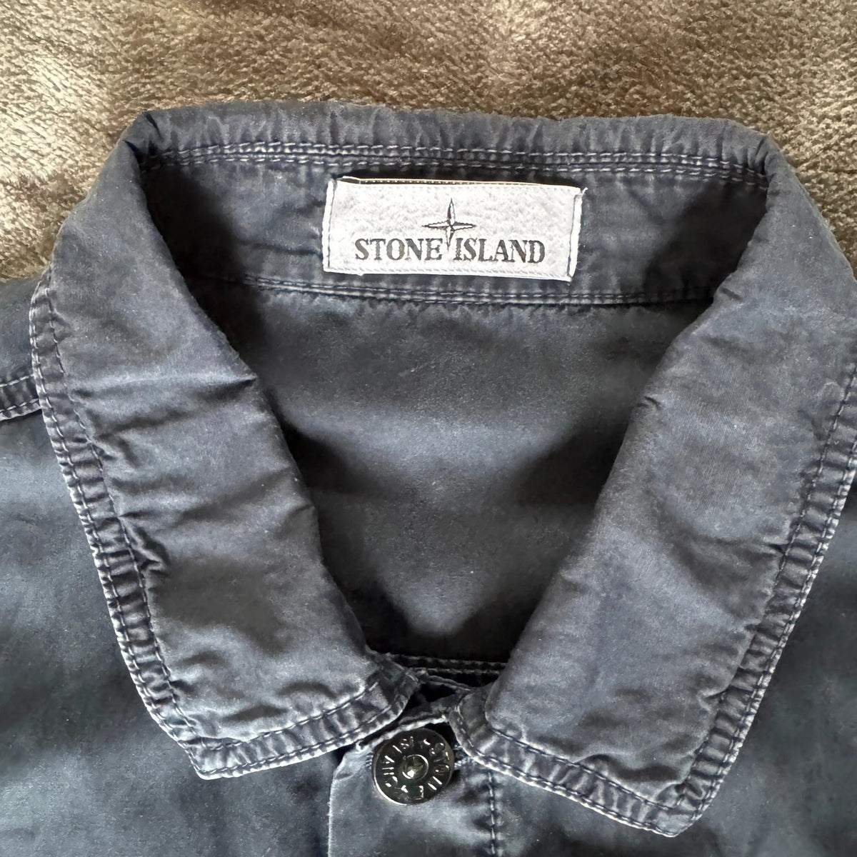 Stone Island navy overshirt with multi pockets and iconic compass logo.