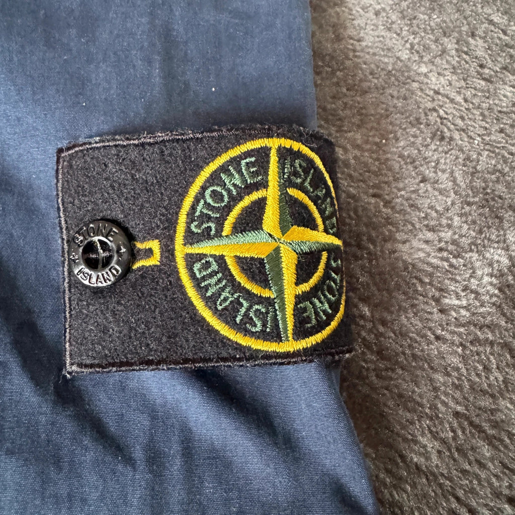 Stone Island navy overshirt with multi pockets and iconic compass logo.