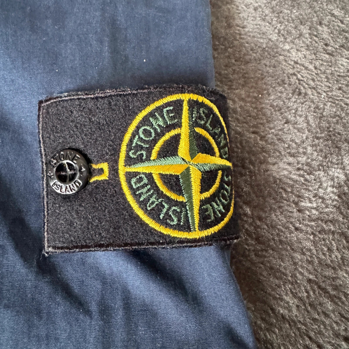 Stone Island navy overshirt with multi pockets and iconic compass logo.