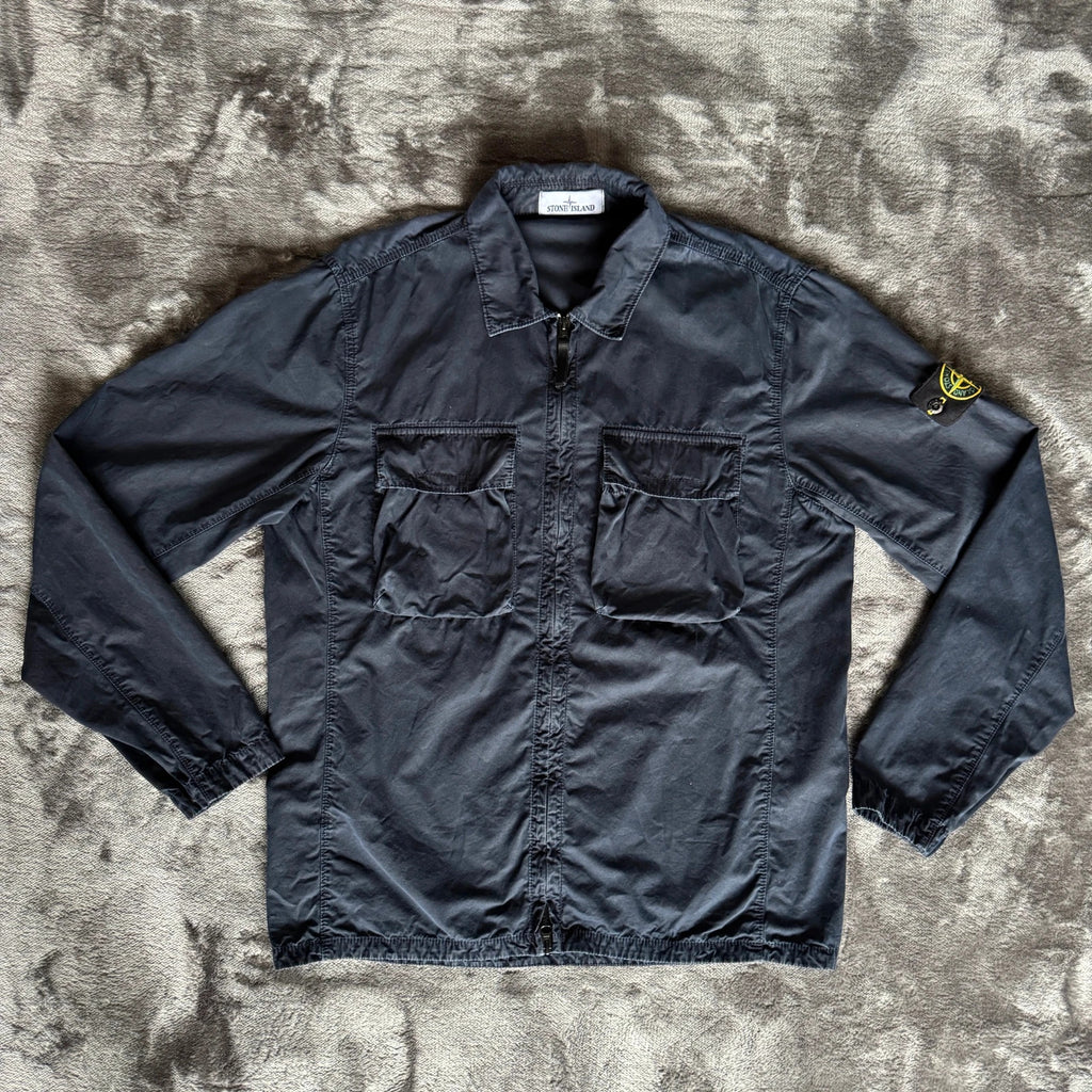 Stone Island navy overshirt featuring iconic compass logo and durable fabric.