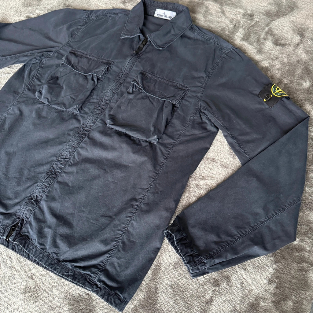 Stone Island navy overshirt featuring iconic compass logo and durable fabric.
