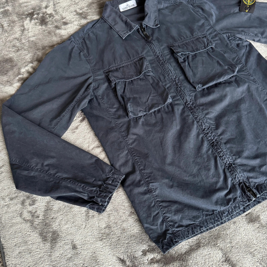 Stone Island navy overshirt featuring iconic compass logo and durable fabric.