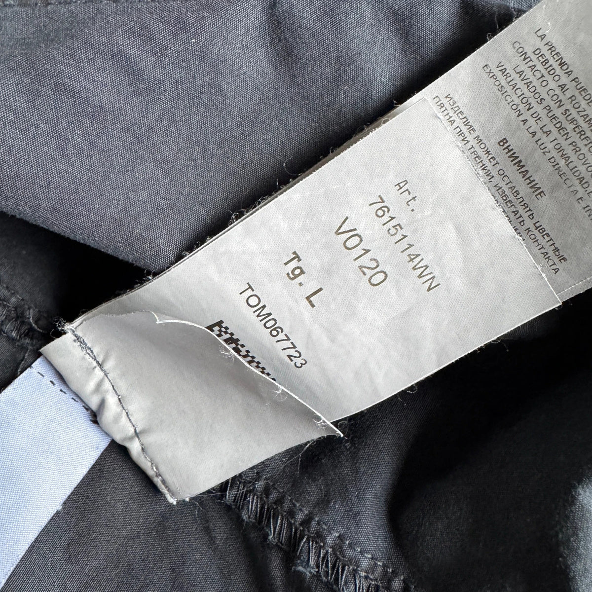 Stone Island navy overshirt featuring iconic compass logo and durable fabric.