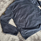 Stone Island navy overshirt featuring iconic compass logo and durable fabric.