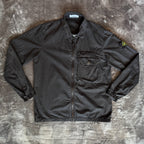Stone Island black overshirt with logo patch and button-up front detail.