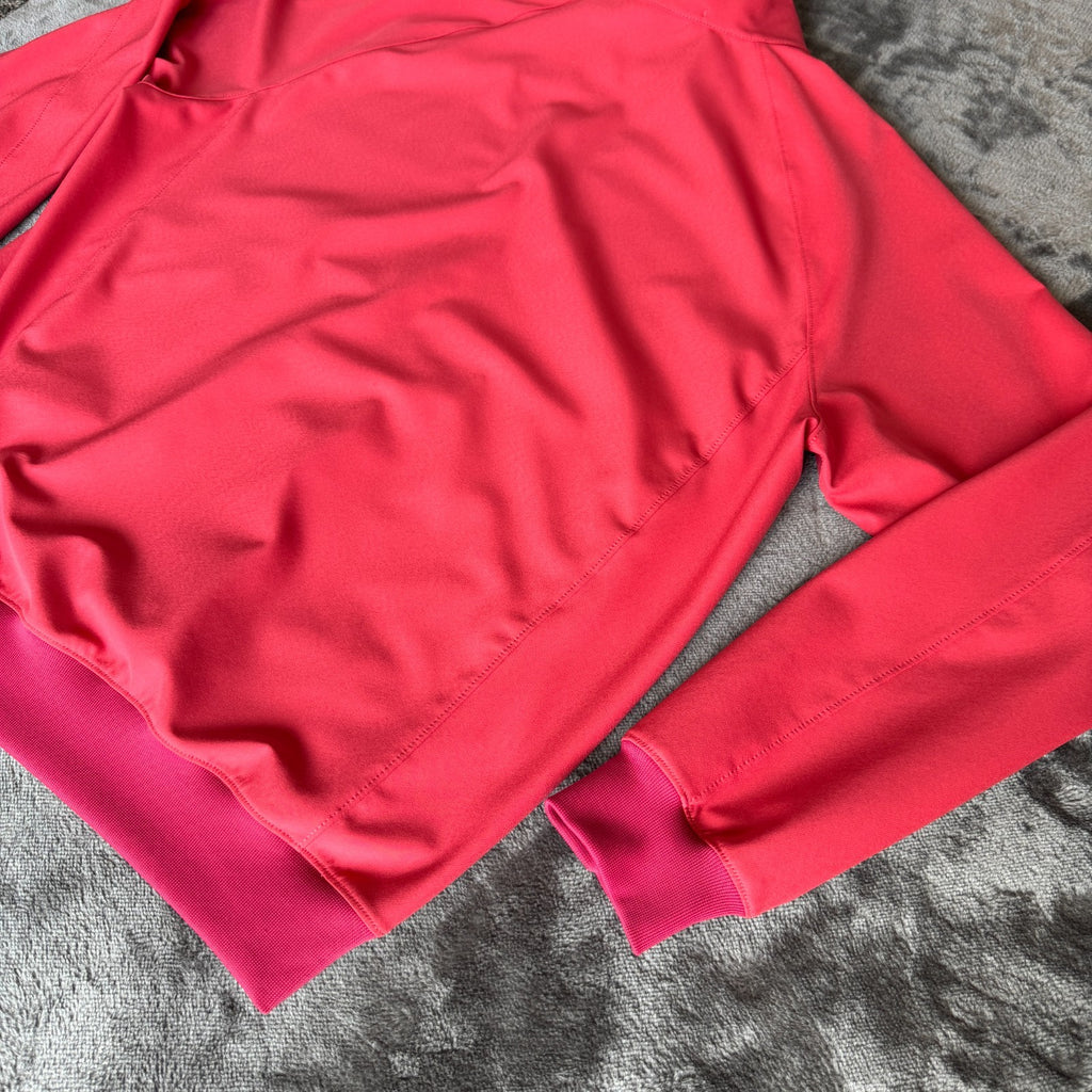 Stone Island fuchsia track jacket with logo badge and stretch nylon material.