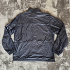 Stone Island navy quilted jacket with logo patch and micro rip stop material.