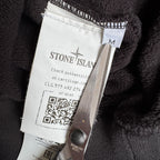 Stone Island black crewneck sweatshirt with zipped pocket and iconic compass logo.
