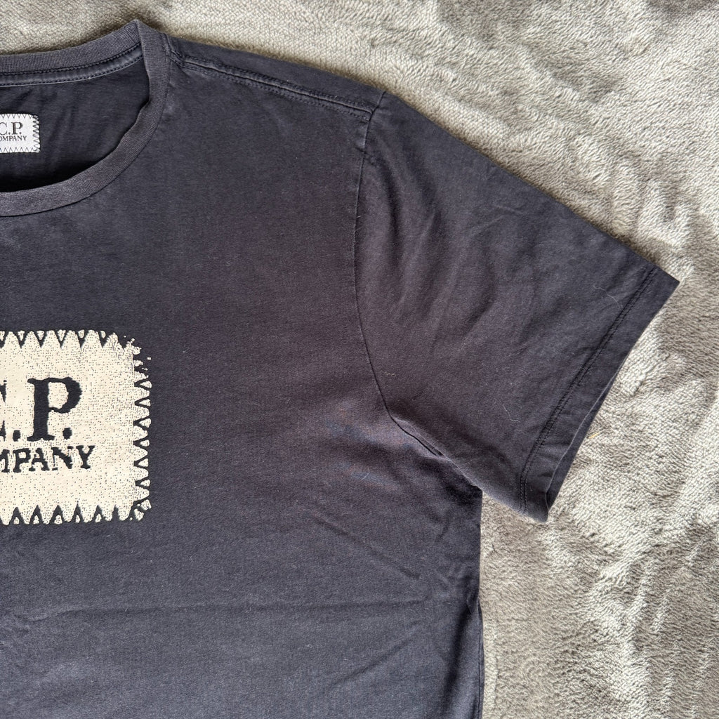 C.P. Company navy t-shirt with stamped logo and soft cotton material.