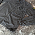 Stone Island black overshirt with logo patch and button-up front detail.
