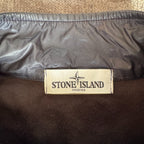 Stone Island navy quilted jacket with logo patch and micro rip stop material.