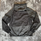 Stone Island black nylon metal Watro jacket with logo badge and visible wear marks.