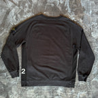 Stone Island black crewneck sweatshirt with 40th anniversary badge and logo patch.