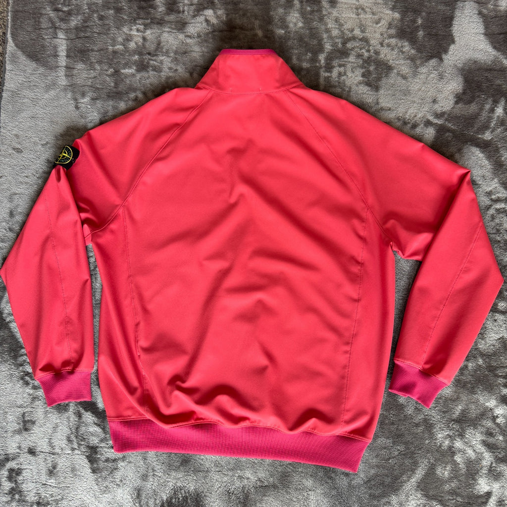 Stone Island fuchsia track jacket with logo badge and stretch nylon material.