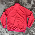 Stone Island fuchsia track jacket with logo badge and stretch nylon material.