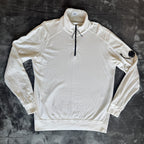 C.P. Company white quarter zip sweatshirt with logo patch and soft cotton material.