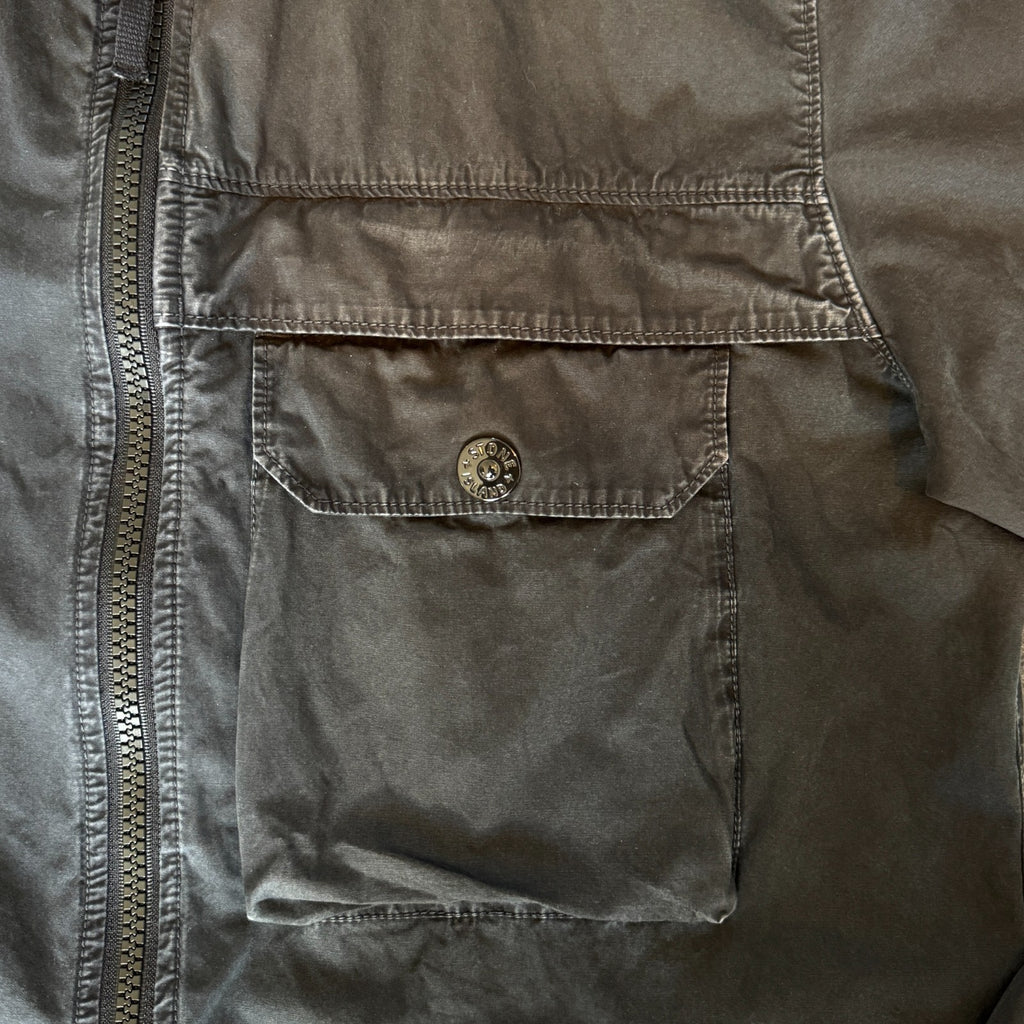 Stone Island black overshirt with logo patch and button-up front detail.