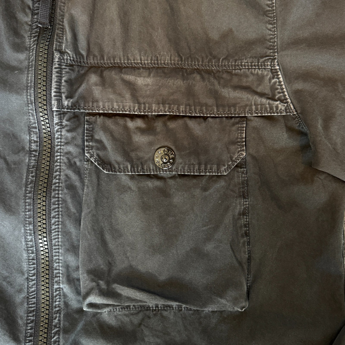 Stone Island black overshirt with logo patch and button-up front detail.