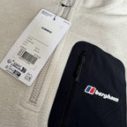 Berghaus off-white half-zip fleece with black logo pocket and stand-up collar.