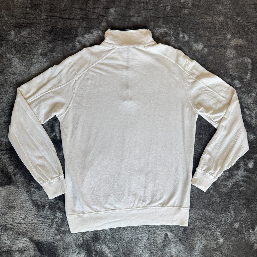 C.P. Company white quarter zip sweatshirt with logo patch and soft cotton material.