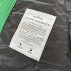 Stone Island green down jacket with logo patch and 0-cotton/R-nylon material.