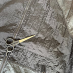 Stone Island black nylon metal Watro jacket with logo badge and visible wear marks.
