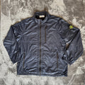 Stone Island navy quilted jacket with logo patch and micro rip stop material.