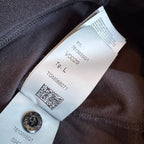 Stone Island black crewneck sweatshirt with 40th anniversary badge and logo patch.