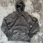 Stone Island black nylon metal Watro jacket with logo badge and visible wear marks.