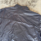 Stone Island navy quilted jacket with logo patch and micro rip stop material.