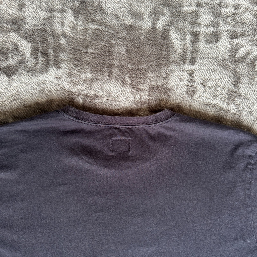 C.P. Company navy t-shirt with stamped logo and soft cotton material.
