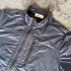 Stone Island navy quilted jacket with logo patch and micro rip stop material.