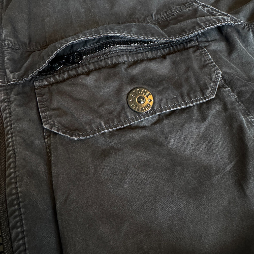 Stone Island black overshirt with logo patch and button-up front detail.