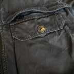 Stone Island black overshirt with logo patch and button-up front detail.
