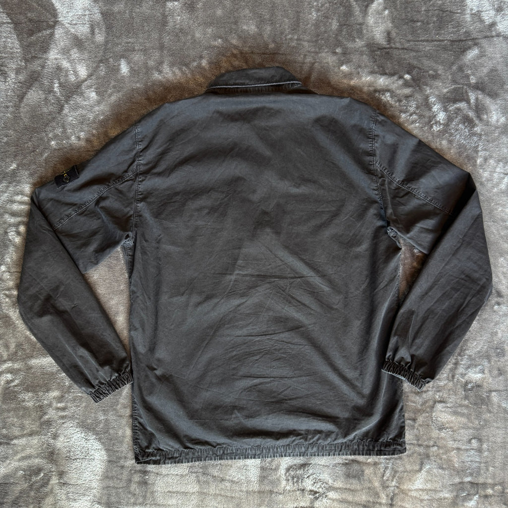 Stone Island black overshirt with logo patch and button-up front detail.